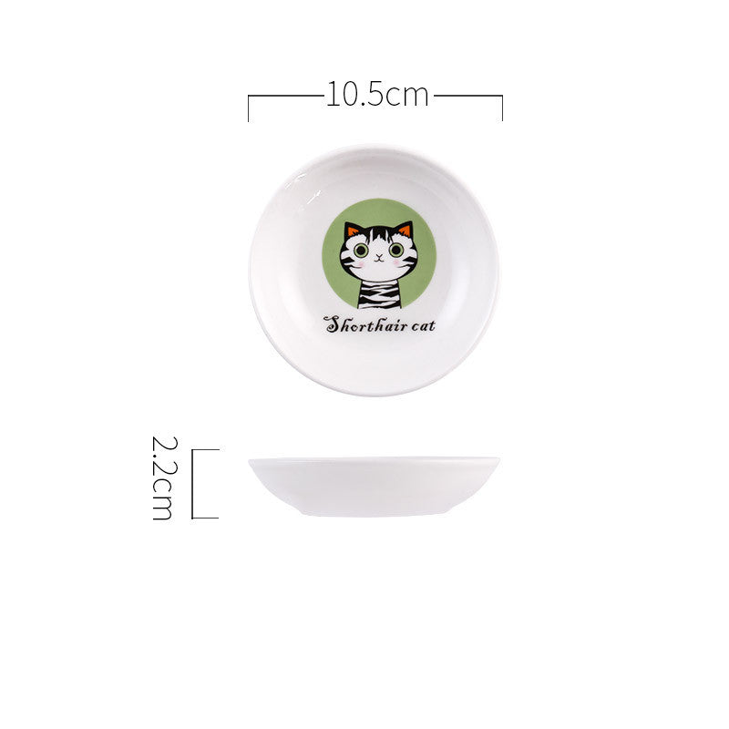 Small round white dish with a cat illustration and text, shown with dimensions on a white background.