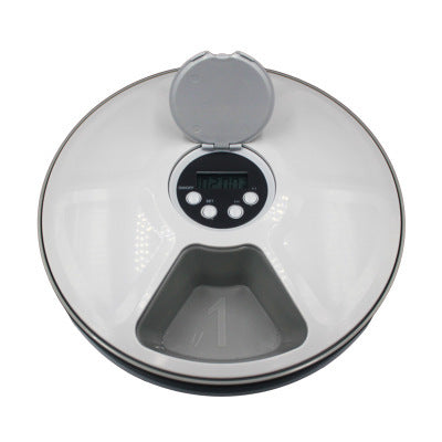 Digital kitchen scale with a clear lid on a white background