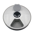 Digital kitchen scale with a clear lid on a white background