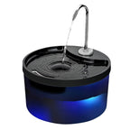 Pet water fountain with blue base and black top on a white background